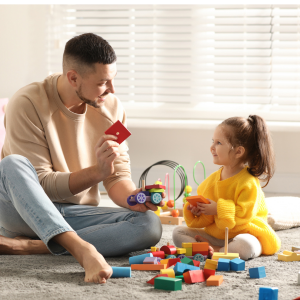 Dad playing with building blocks